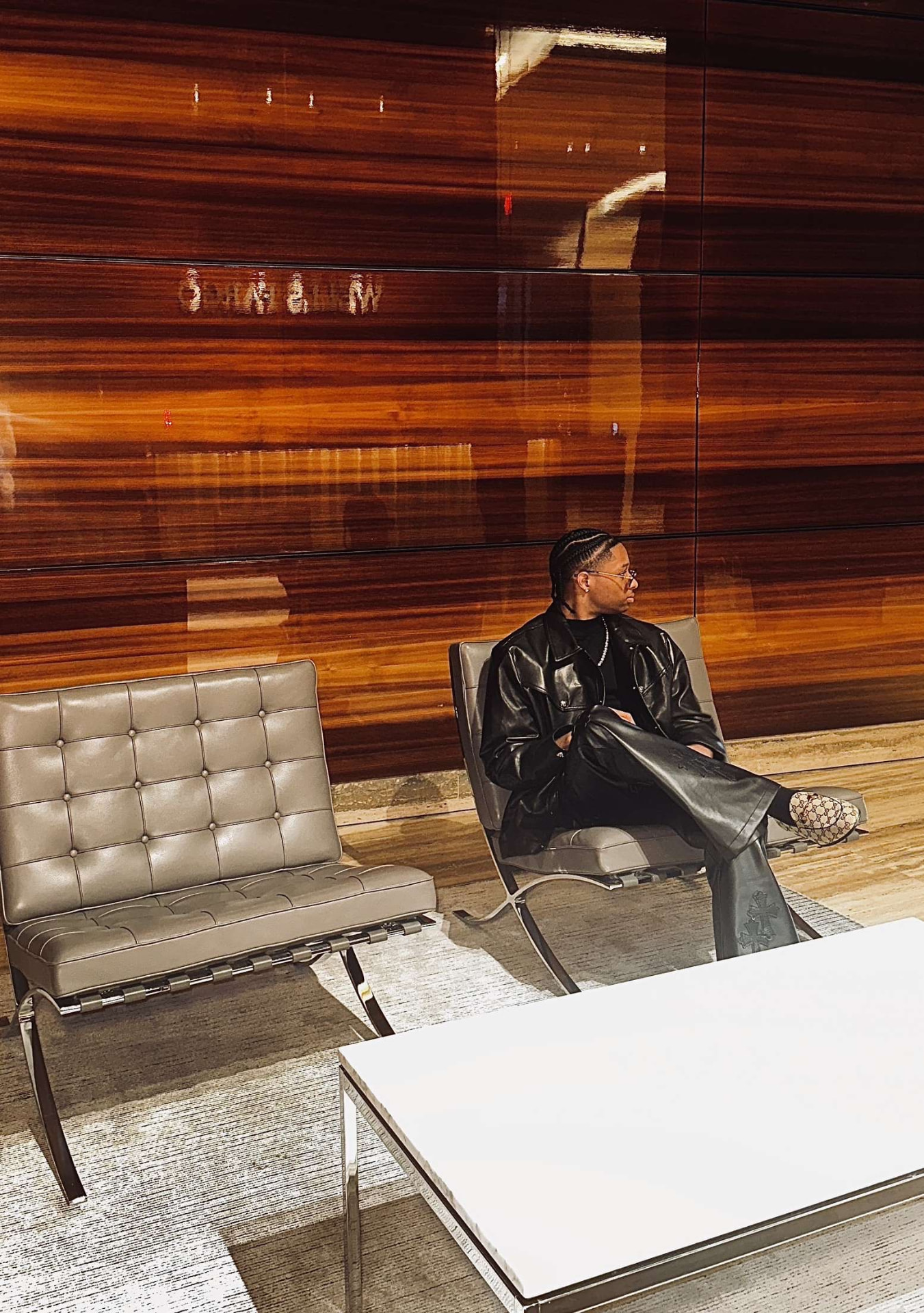 Rinvel Rousseau Jr. seated in a corporate lobby
